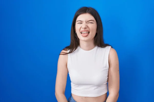 Young Caucasian Woman Standing Blue Background Sticking Tongue Out Happy — Photo
