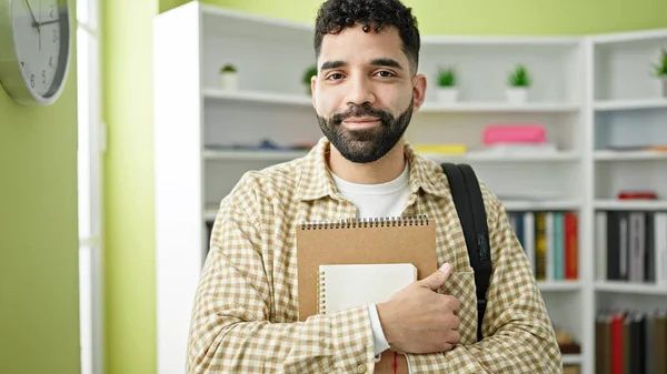 Young Hispanic Man Student Smiling Confident Holding Notebooks Library University — Stock Photo, Image
