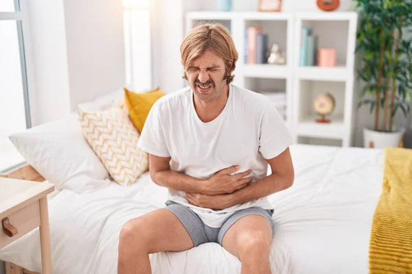 Young Blond Man Suffering Stomach Ache Sitting Bed Bedroom — Stock Photo, Image