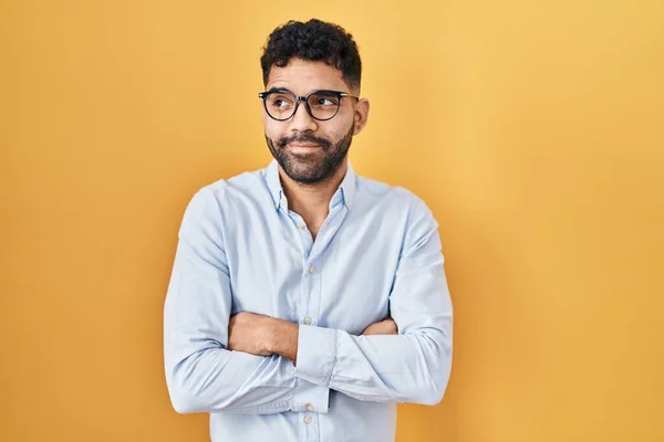 Hispanic Man Beard Standing Yellow Background Smiling Looking Side Staring — Stok fotoğraf