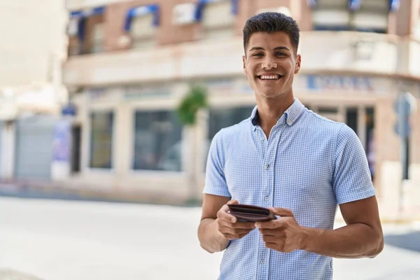 Young Hispanic Man Smiling Confident Holding Leather Wallet Street — Fotografia de Stock