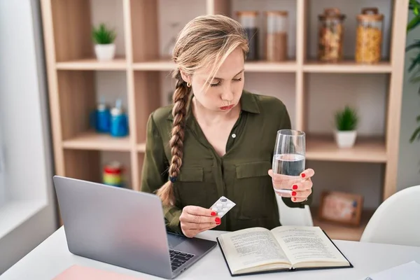 Young Blonde Woman Sitting Table Studying Taking Pills Home — Stockfoto