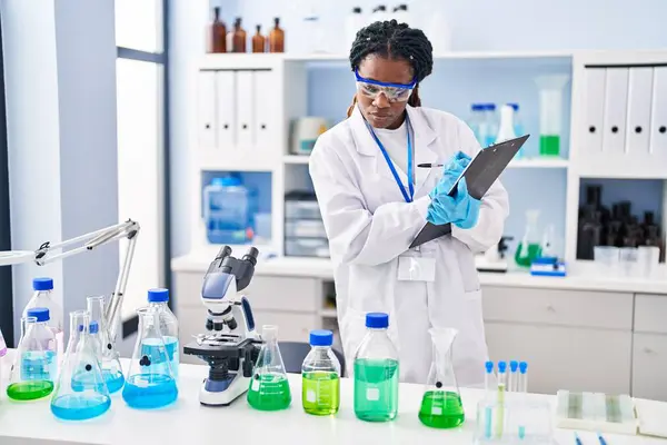 African American Woman Scientist Writing Report Working Laboratory — Stockfoto