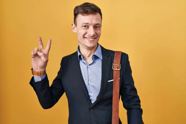 Caucasian Business Man Yellow Background Smiling Looking Camera Showing Fingers — Stock Photo, Image