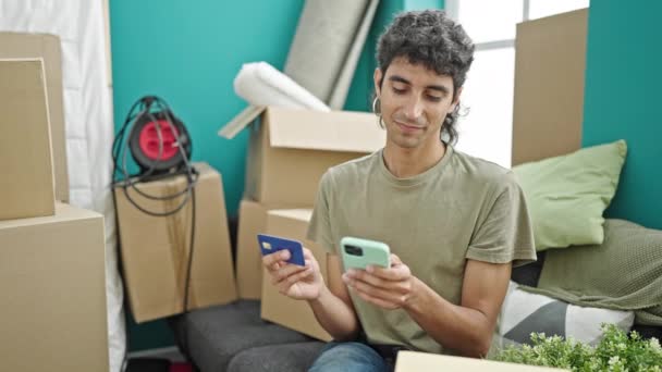 Young Hispanic Man Shopping Smartphone Credit Card Sitting Sofa New — Stock Video