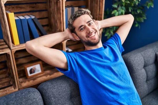 Young Man Relaxed Hands Head Sitting Sofa Home — Stockfoto