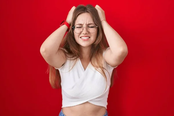 Young Caucasian Woman Standing Red Background Suffering Headache Desperate Stressed — Stock Photo, Image