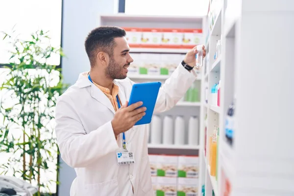 Young Hispanic Man Pharmacist Using Touchpad Working Pharmacy — Stock Photo, Image