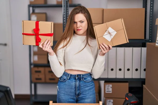 Young Caucasian Woman Working Small Business Ecommerce Skeptic Nervous Frowning — Zdjęcie stockowe