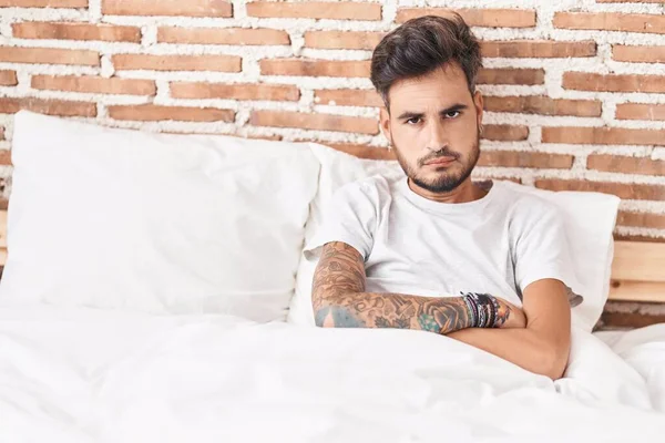 Young Hispanic Man Sitting Bed Unhappy Expression Arms Crossed Gesture — Fotografia de Stock