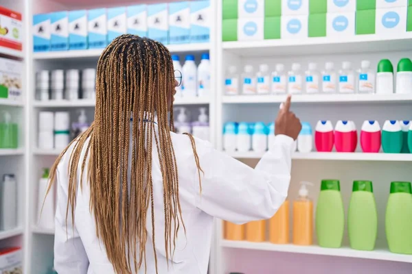 African American Woman Pharmacist Holding Deodorant Shelving Pharmacy — Stock Photo, Image