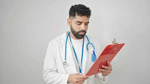 Young Hispanic Man Doctor Reading Document Clipboard Isolated White Background — Stock Photo, Image