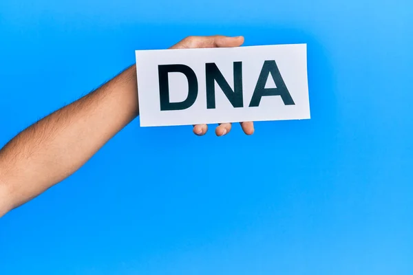 Hand Caucasian Man Holding Paper Dna Word Isolated White Background — Foto Stock