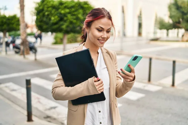 Young Caucasian Woman Business Worker Using Smartphone Holding Binder Street — Stok fotoğraf