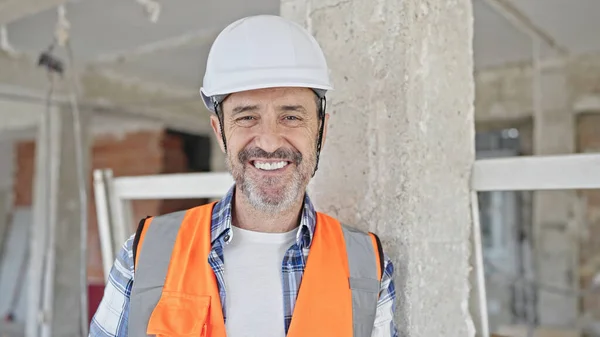 stock image Middle age man builder smiling confident standing at construction site