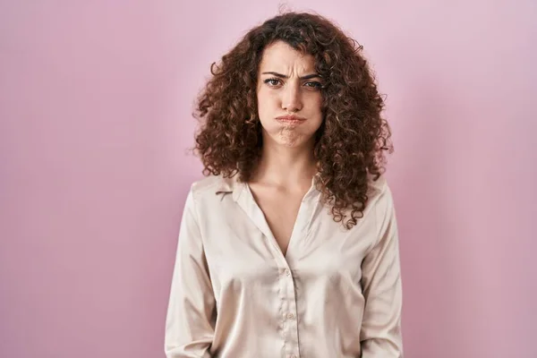 Hispanic Woman Curly Hair Standing Pink Background Puffing Cheeks Funny — Zdjęcie stockowe