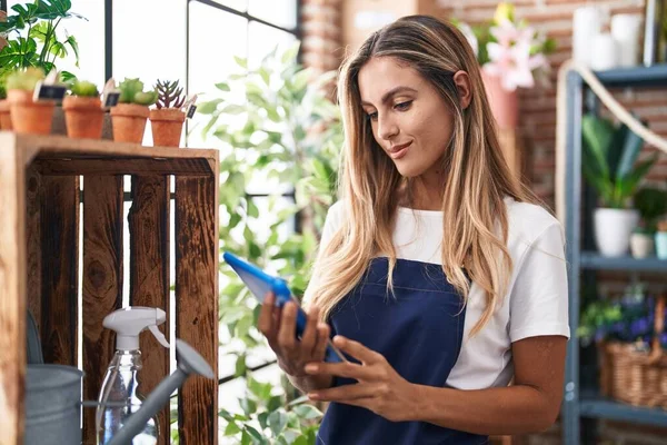 Young Blonde Woman Florist Smiling Confident Using Touchpad Florist — Stok fotoğraf