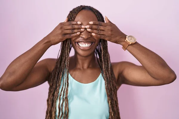 African American Woman Standing Pink Background Covering Eyes Hands Smiling — Stock Photo, Image