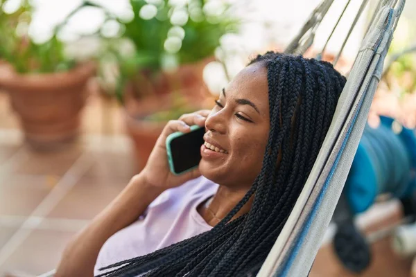 African American Woman Talking Smartphone Lying Hammock Home Terrace — Fotografia de Stock