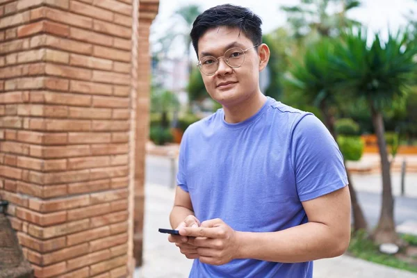 Young Chinese Man Smiling Confident Using Smartphone Street — Foto Stock