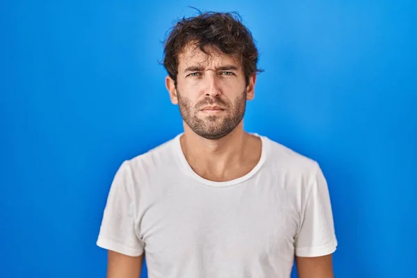 Hispanic Young Man Standing Blue Background Skeptic Nervous Frowning Upset — Foto Stock