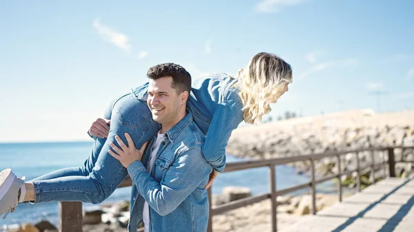 Man Woman Couple Smiling Confident Holding Girlfriend Air Turning Seaside — Stock Photo, Image