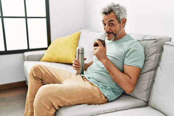 Middle Age Grey Haired Man Drinking Mate Infusion Sitting Sofa — Stock fotografie