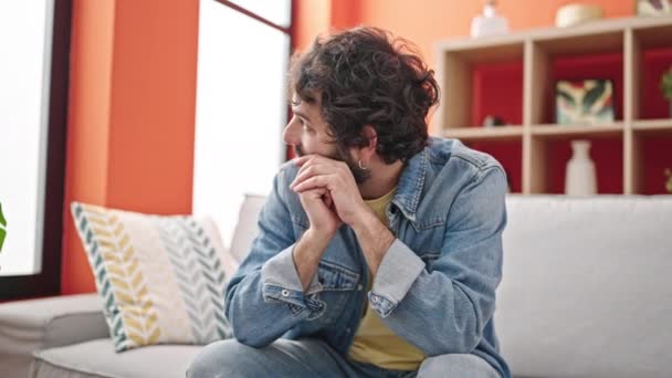 Young Hispanic Man Stressed Sitting Sofa Home — Video