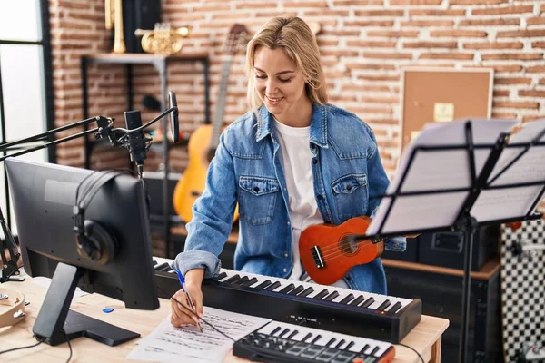 Young Blonde Woman Musician Composing Song Holding Ukelele Music Studio — Stock Photo, Image