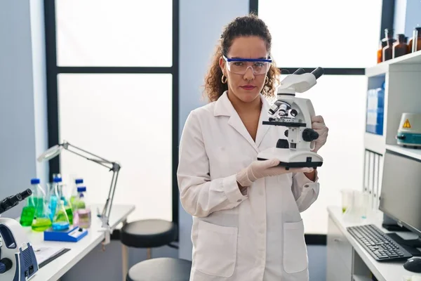 Young Hispanic Woman Working Scientist Laboratory Skeptic Nervous Frowning Upset — Photo