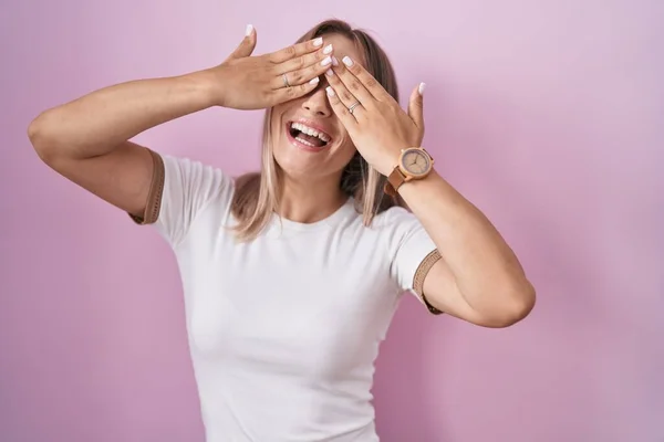 Blonde Caucasian Woman Standing Pink Background Covering Eyes Hands Smiling — Stock Photo, Image