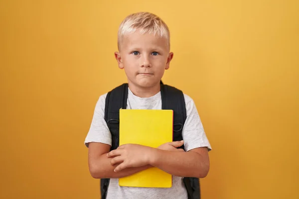 Little Caucasian Boy Wearing Student Backpack Holding Book Thinking Attitude — Stock Photo, Image