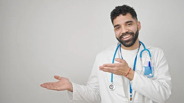 Young Hispanic Man Doctor Smiling Confident Presenting Isolated White Background — Stock Photo, Image