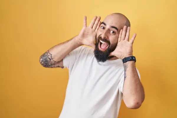 Young Hispanic Man Beard Tattoos Standing Yellow Background Smiling Cheerful — стоковое фото
