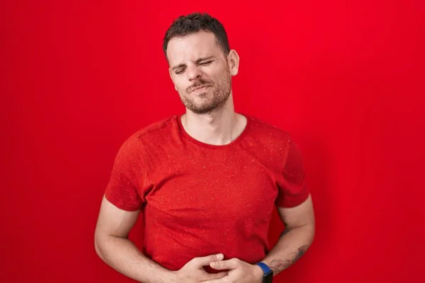 Young Hispanic Man Standing Red Background Hand Stomach Because Indigestion — Stock Photo, Image