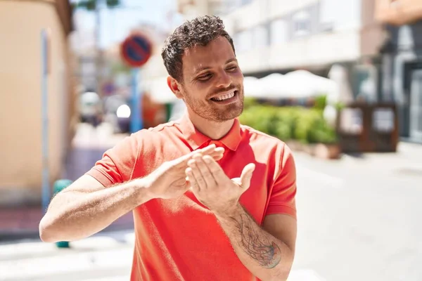 Young Hispanic Man Smiling Confident Doing Spend Money Gesture Street — Foto de Stock