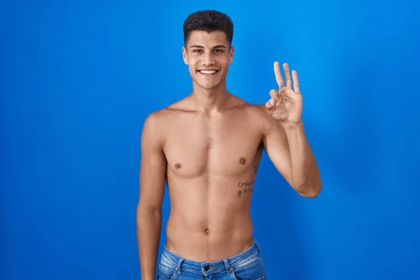 Young Hispanic Man Standing Shirtless Blue Background Showing Pointing Fingers — Stock Photo, Image