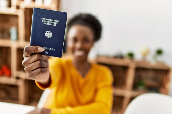 African American Woman Holding Deutchland Passport Sitting Table Home — Foto de Stock