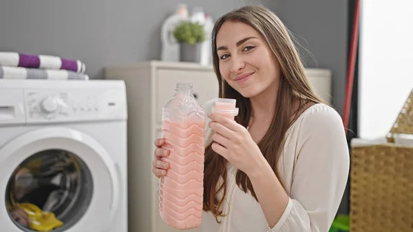 Young Beautiful Hispanic Woman Smiling Confident Smelling Detergent Laundry Room — Stock Photo, Image