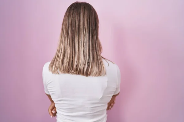 Blonde Caucasian Woman Standing Pink Background Standing Backwards Looking Away — Stock Photo, Image