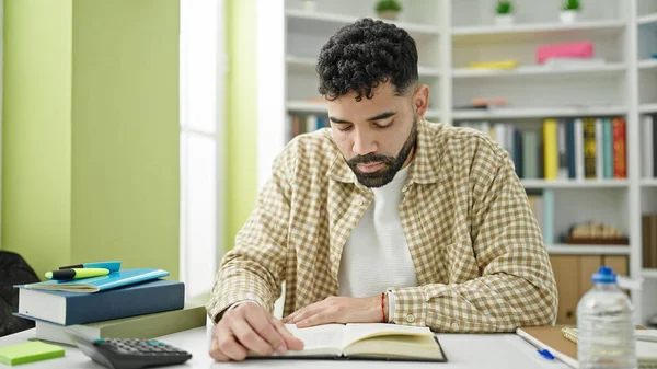 Young Hispanic Man Student Reading Book Library University — Stock Photo, Image