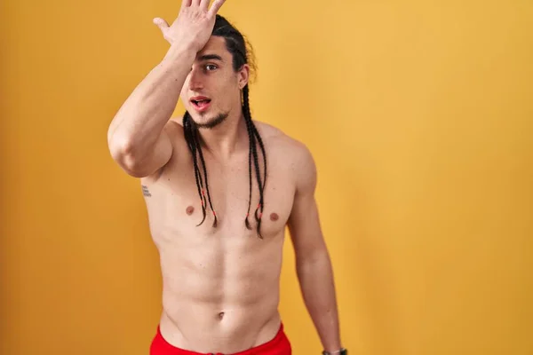 Hispanic Man Long Hair Standing Shirtless Yellow Background Surprised Hand — Stock Photo, Image