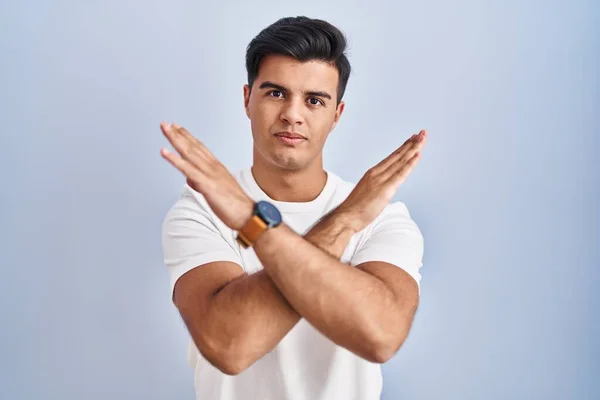 Hispanic Man Standing Blue Background Rejection Expression Crossing Arms Doing — Foto Stock