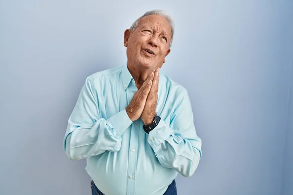 Senior Man Grey Hair Standing Blue Background Begging Praying Hands — Stock Photo, Image