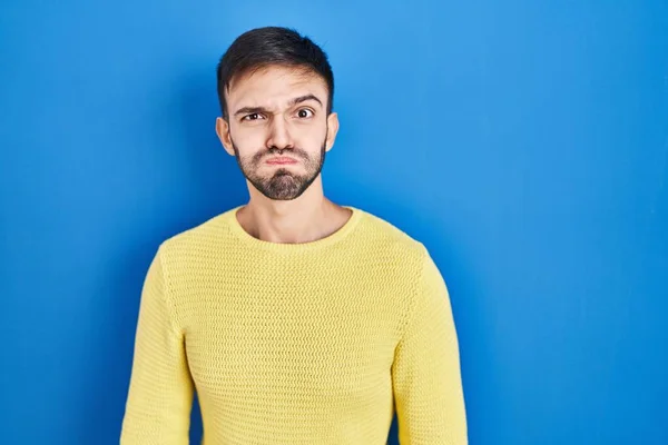 Hispanic Man Standing Blue Background Puffing Cheeks Funny Face Mouth — Stock Photo, Image
