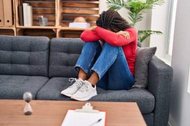 African american woman stressed patient having psychology session at psychology center