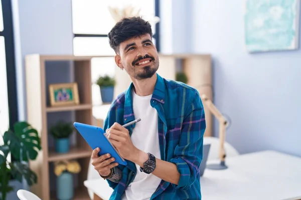 Young Hispanic Man Smiling Confident Writing Touchpad Home — ストック写真