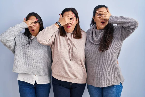 Mother Two Daughters Standing Blue Background Peeking Shock Covering Face — Stock Photo, Image