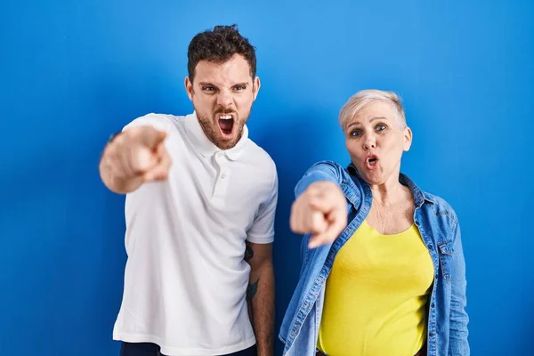 Young Brazilian Mother Son Standing Blue Background Pointing Displeased Frustrated — Stock Photo, Image