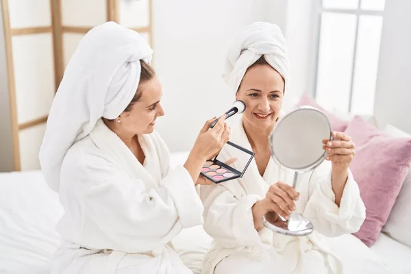 Two Women Mother Daughter Wearing Bathrobe Applying Skin Makeup Bedroom — Foto Stock